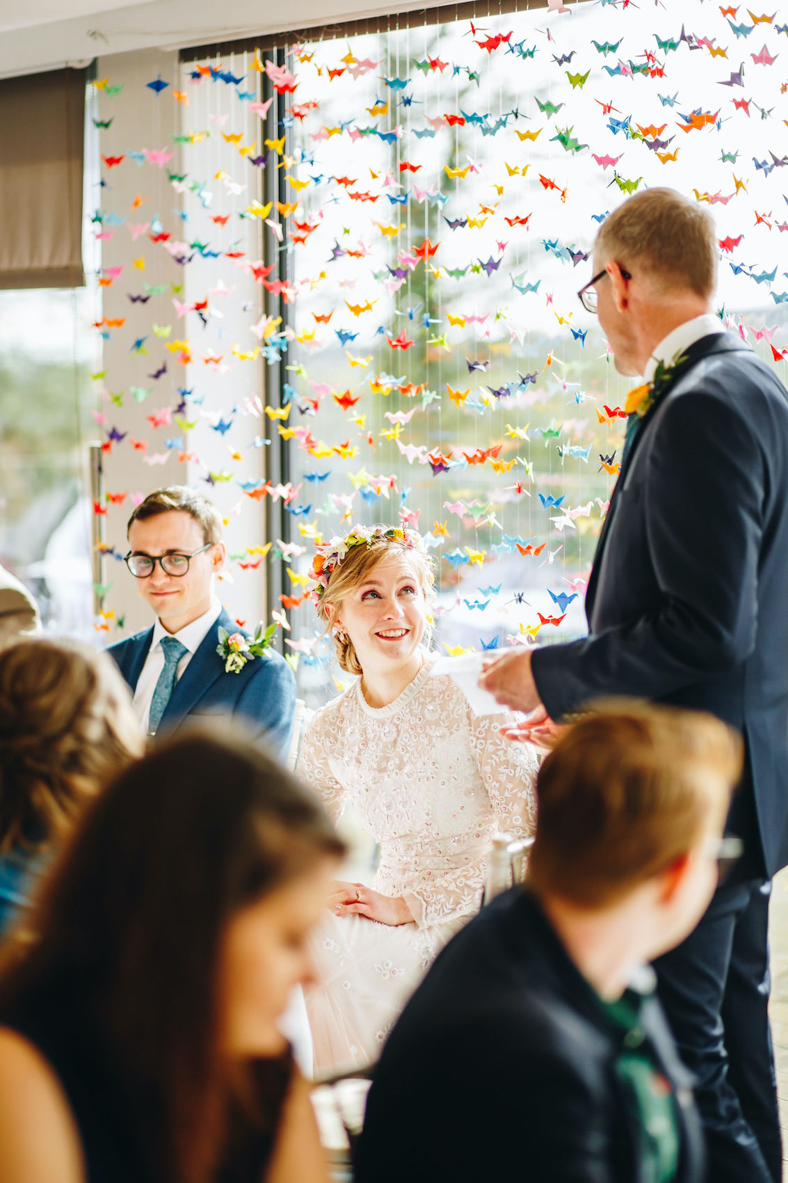 Bride looks up at dad as he delivers his speech