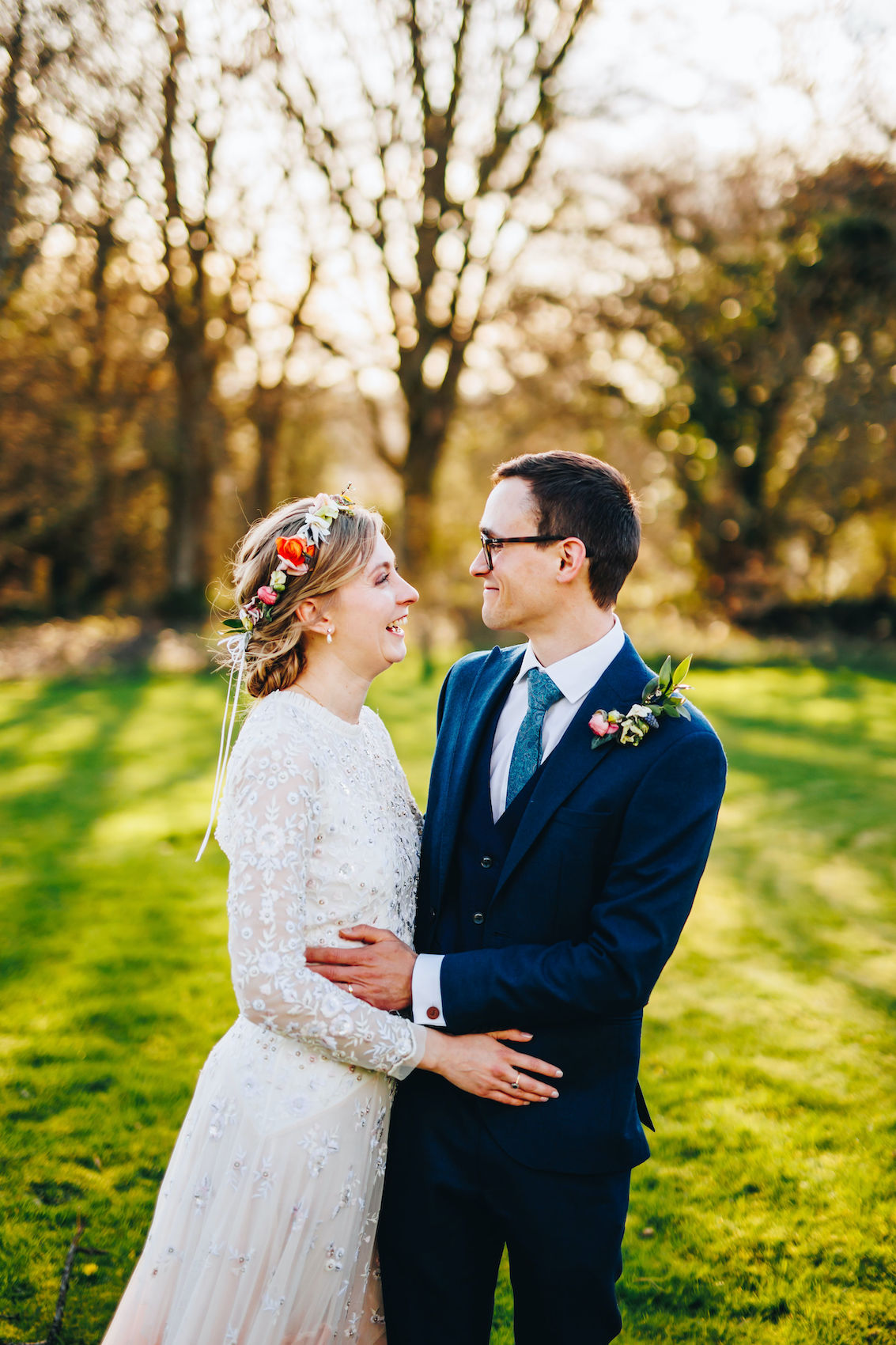 Bride and groom looking at each other in the evening sunlight