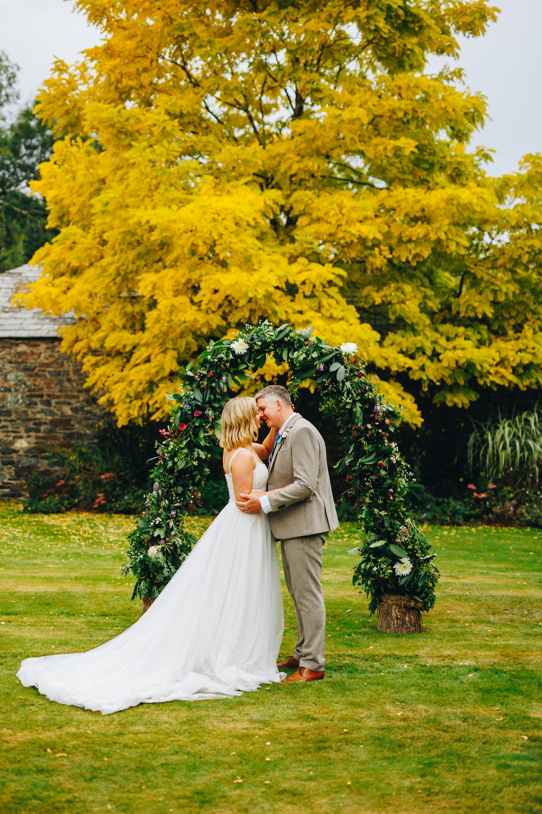 Couple kiss at top of aisle