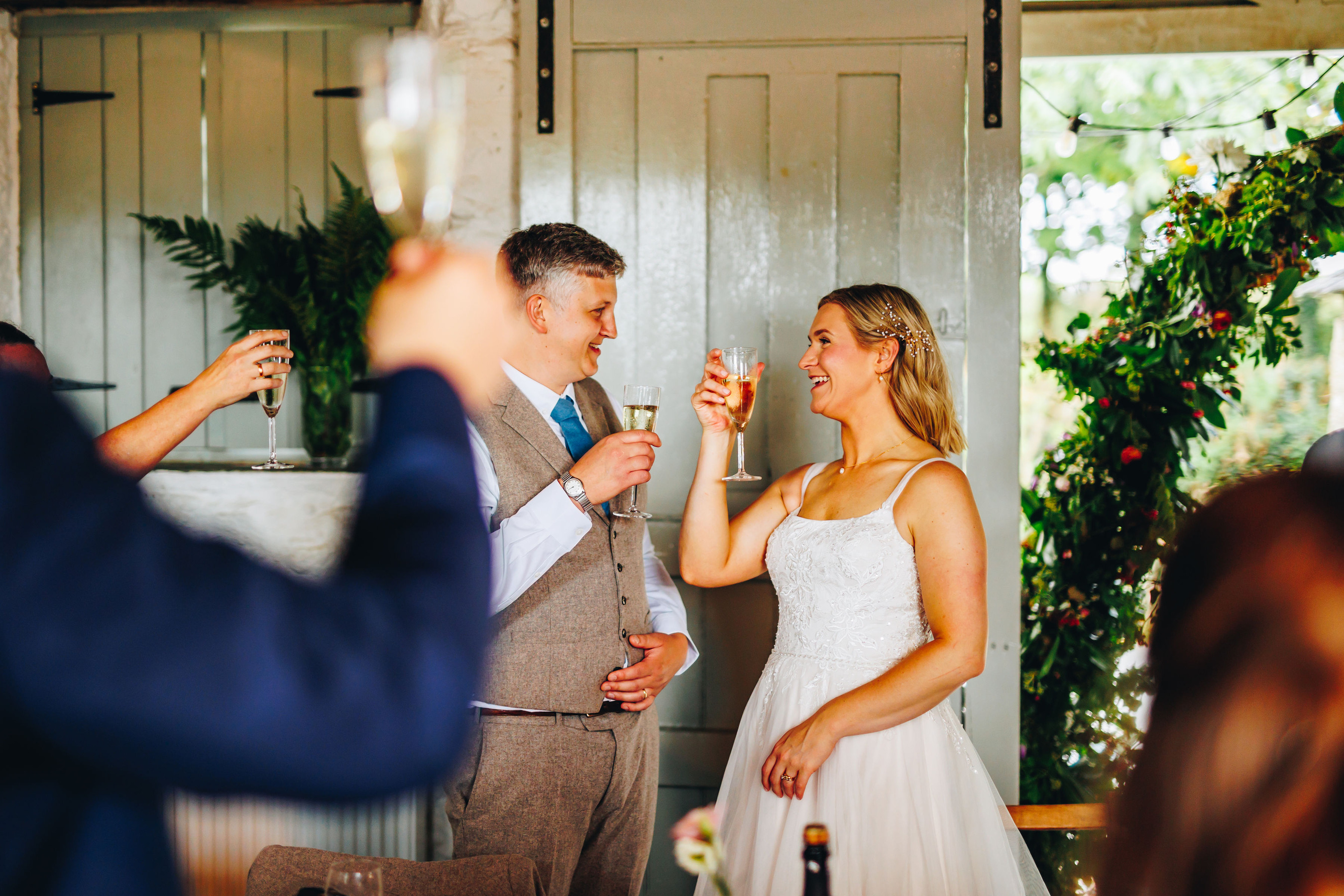 Couple cheersing at wedding reception