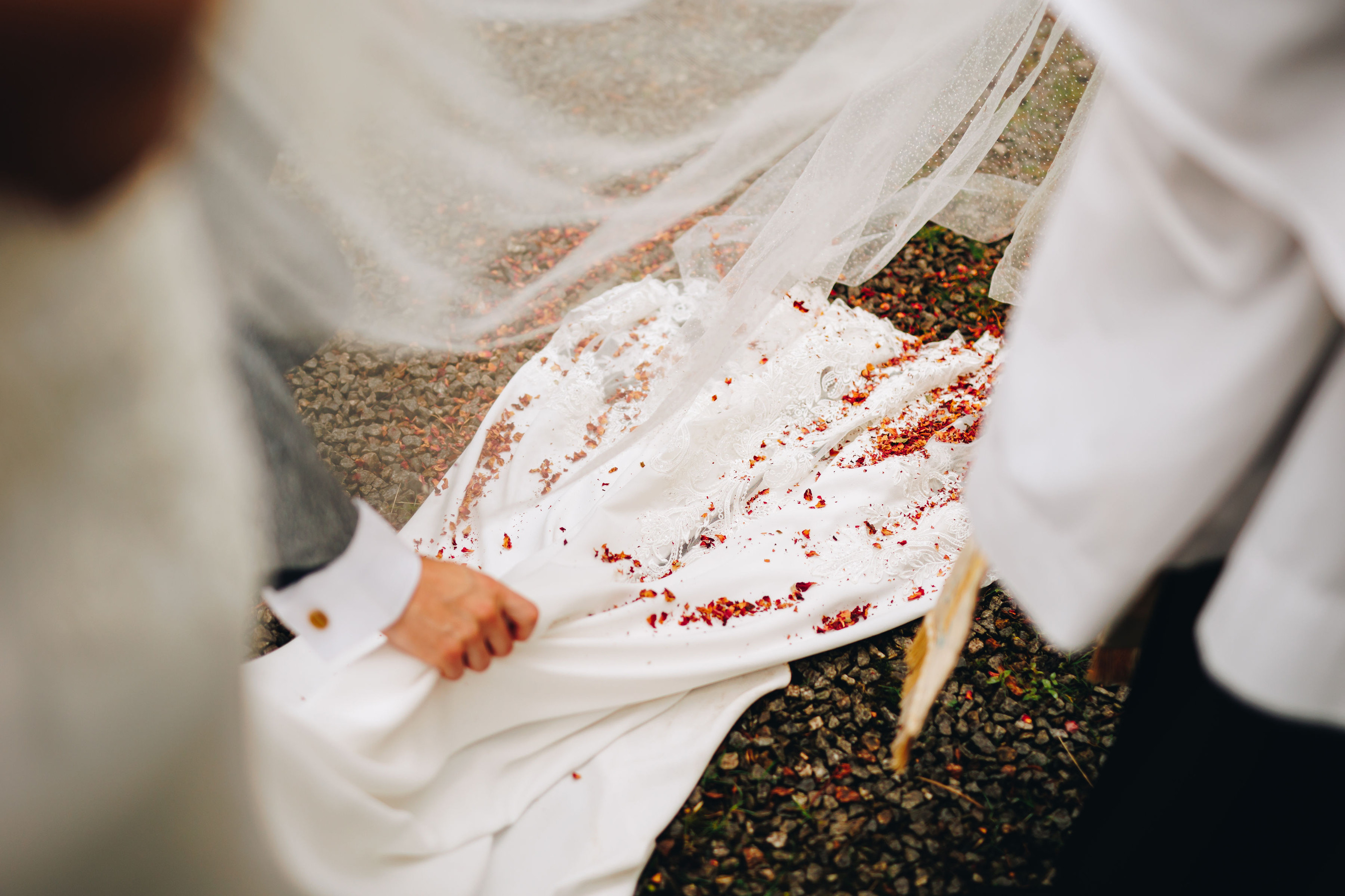 End of bridal gown train covered with confetti