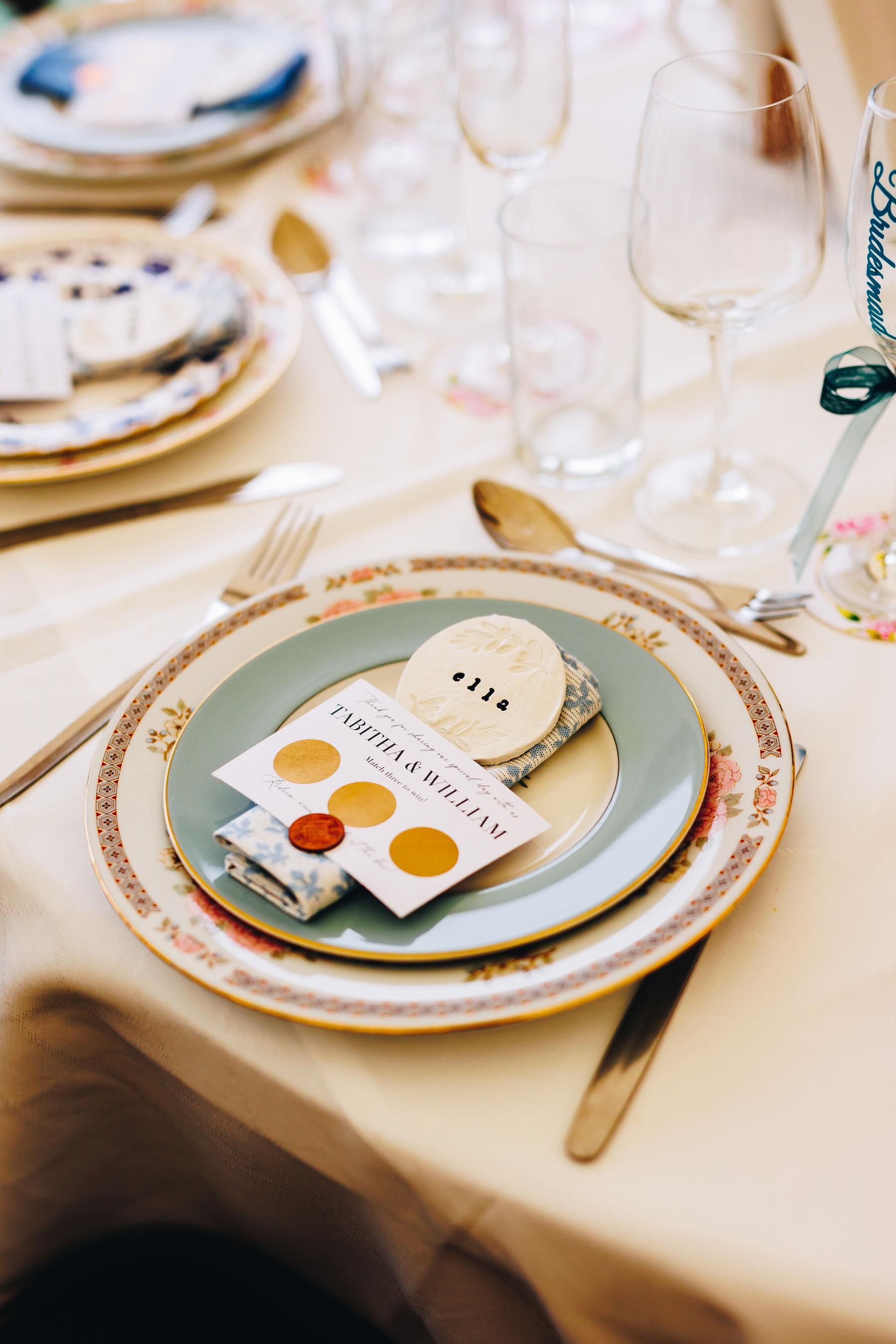 Table wedding reception set up - place cards and scratch cards on plates