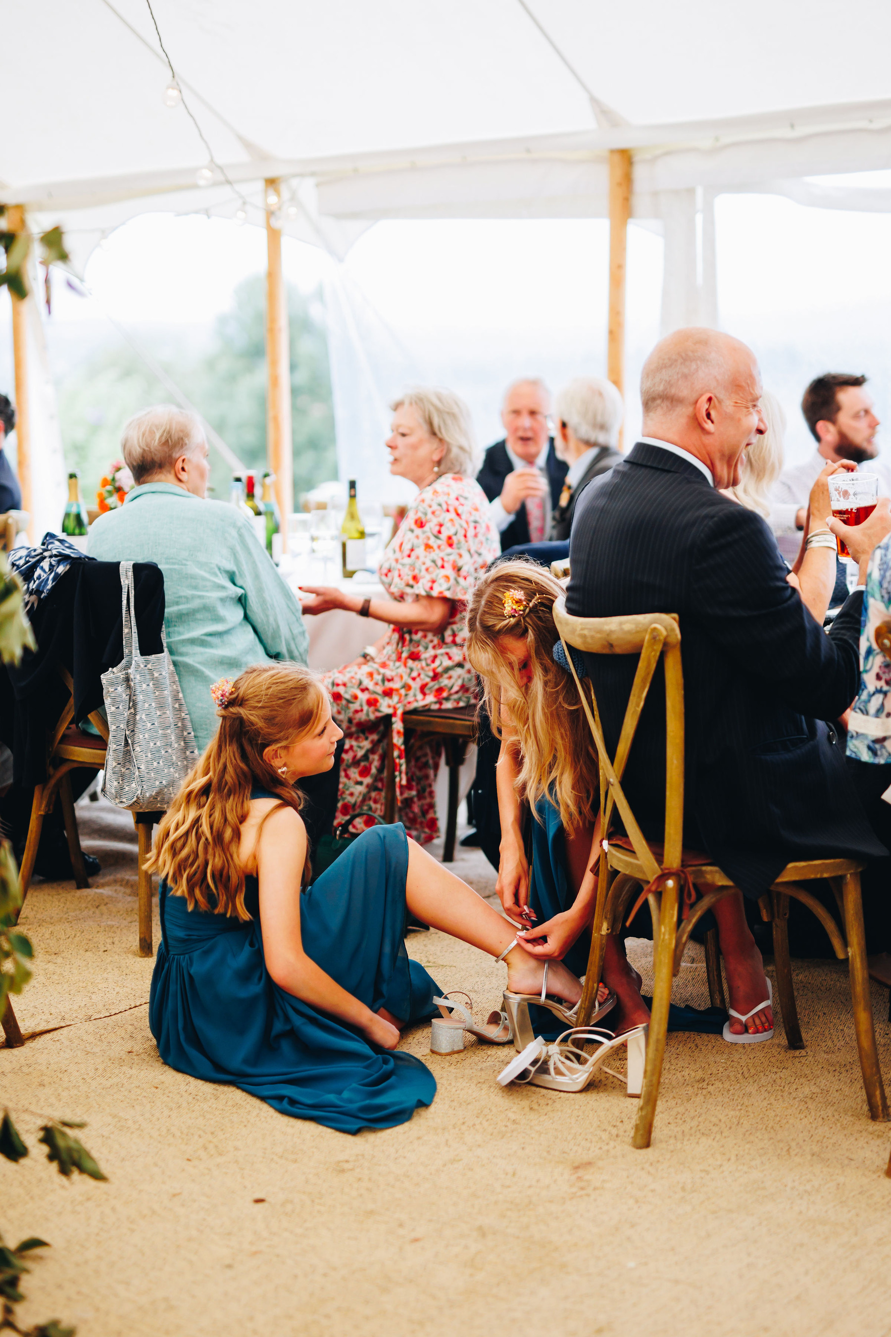 Bridesmaids try on each other's shoes