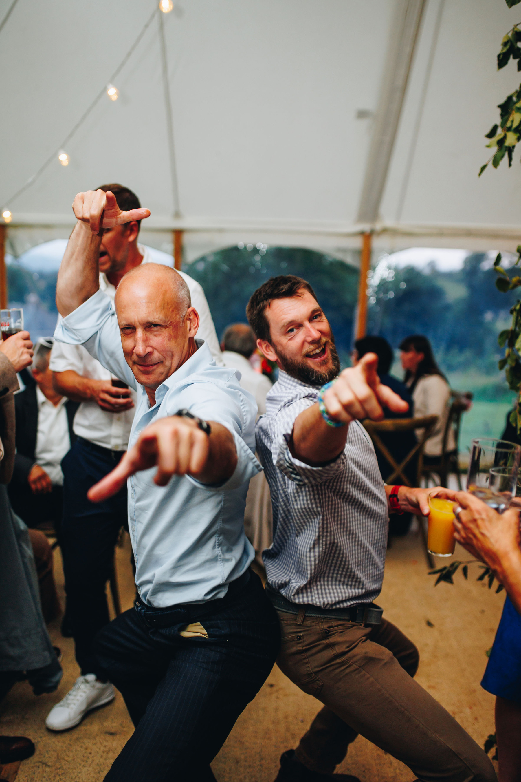 Guests dance while posing for a photo