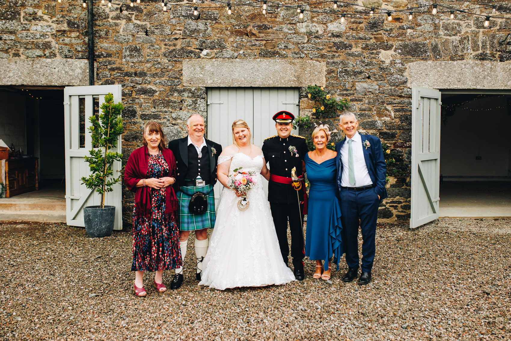 Wedding family photo in front of barn