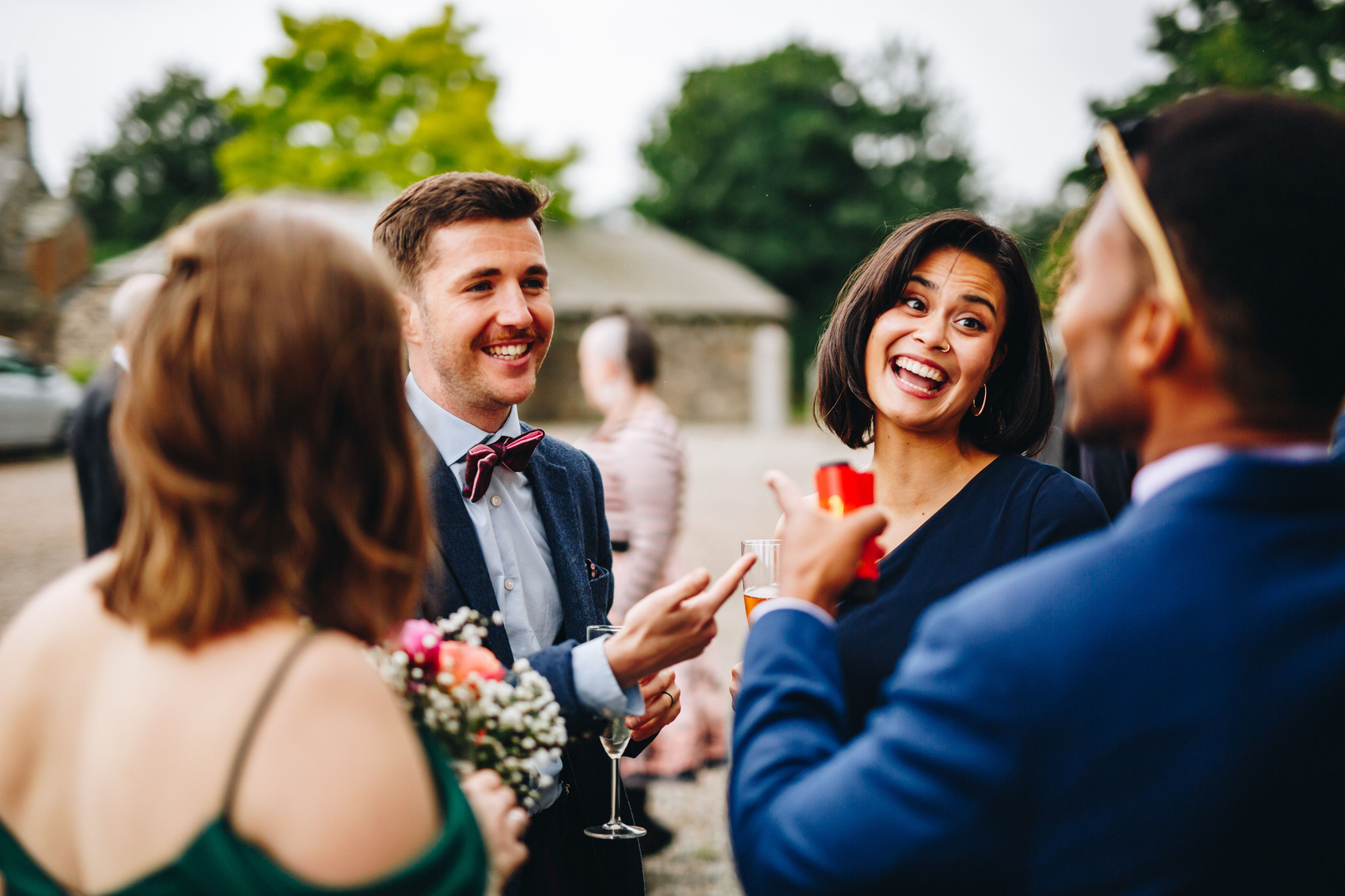 Wedding guests mingling and laughing