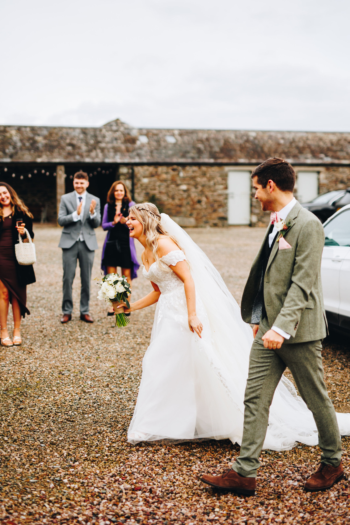 Bride and groom arriving in the courtyard