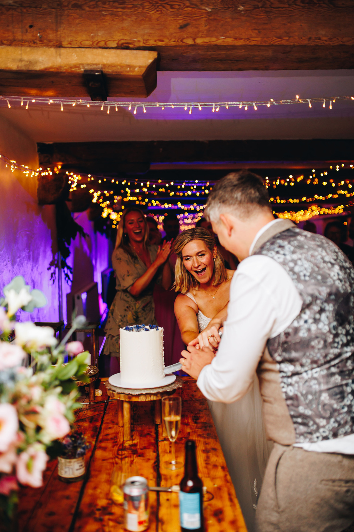 Couple cutting wedding cake