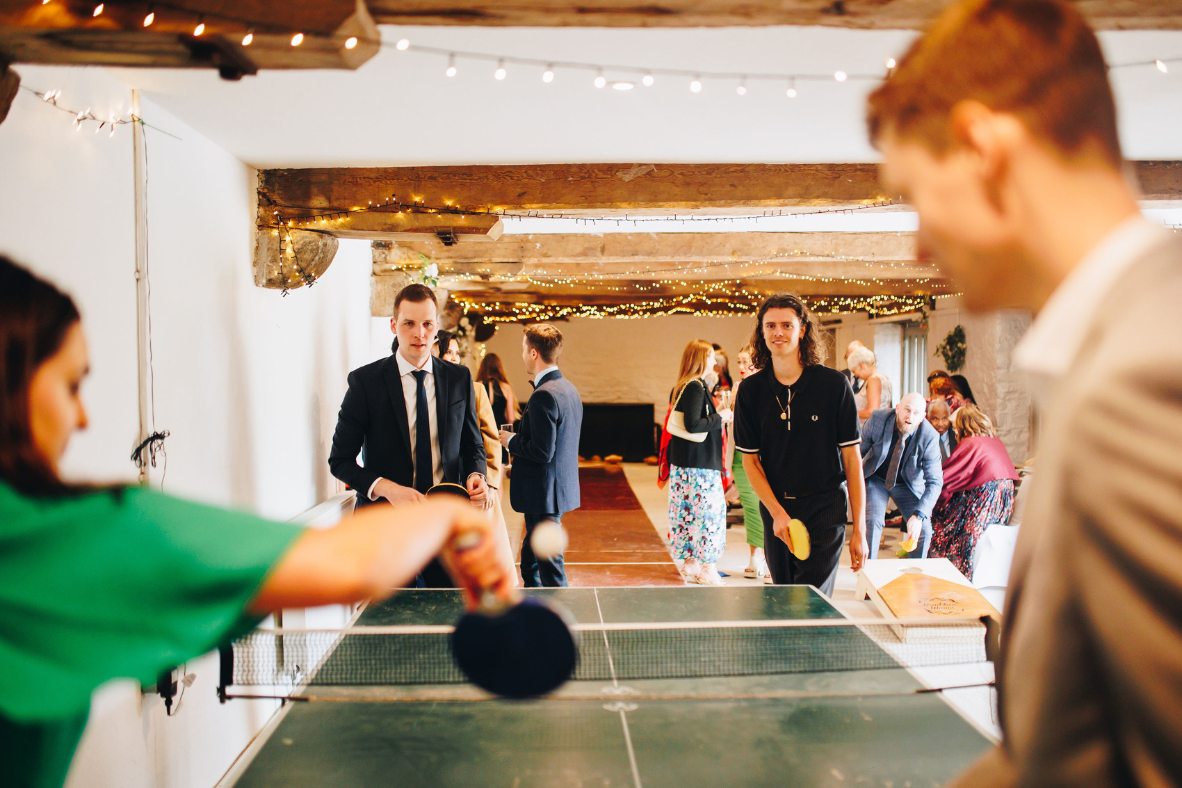 Wedding guests playing table tennis