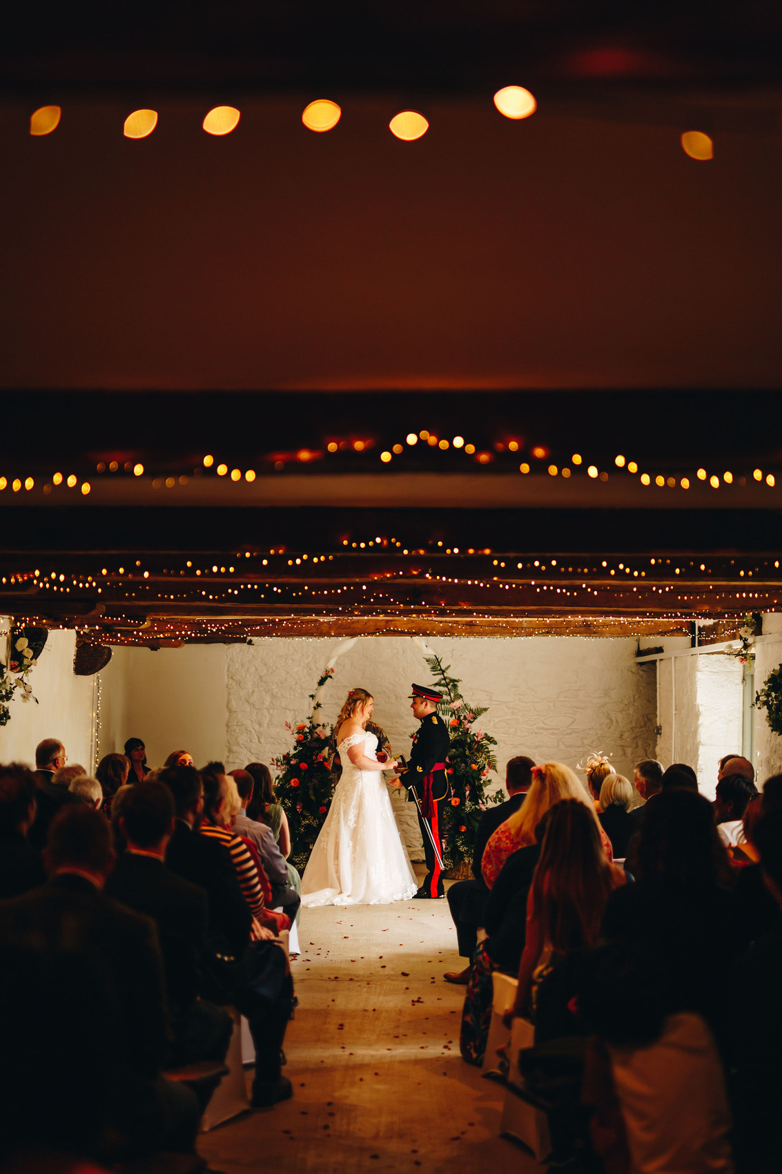 Couple getting married at top of aisle