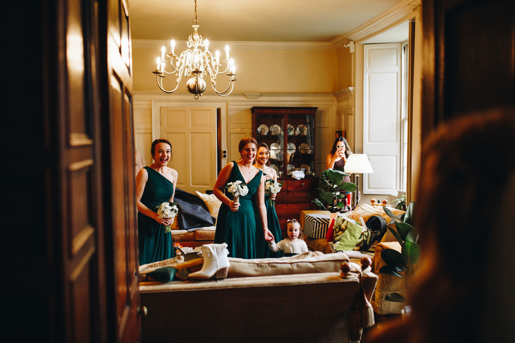 Bridesmaids seeing bride for the first time in dress