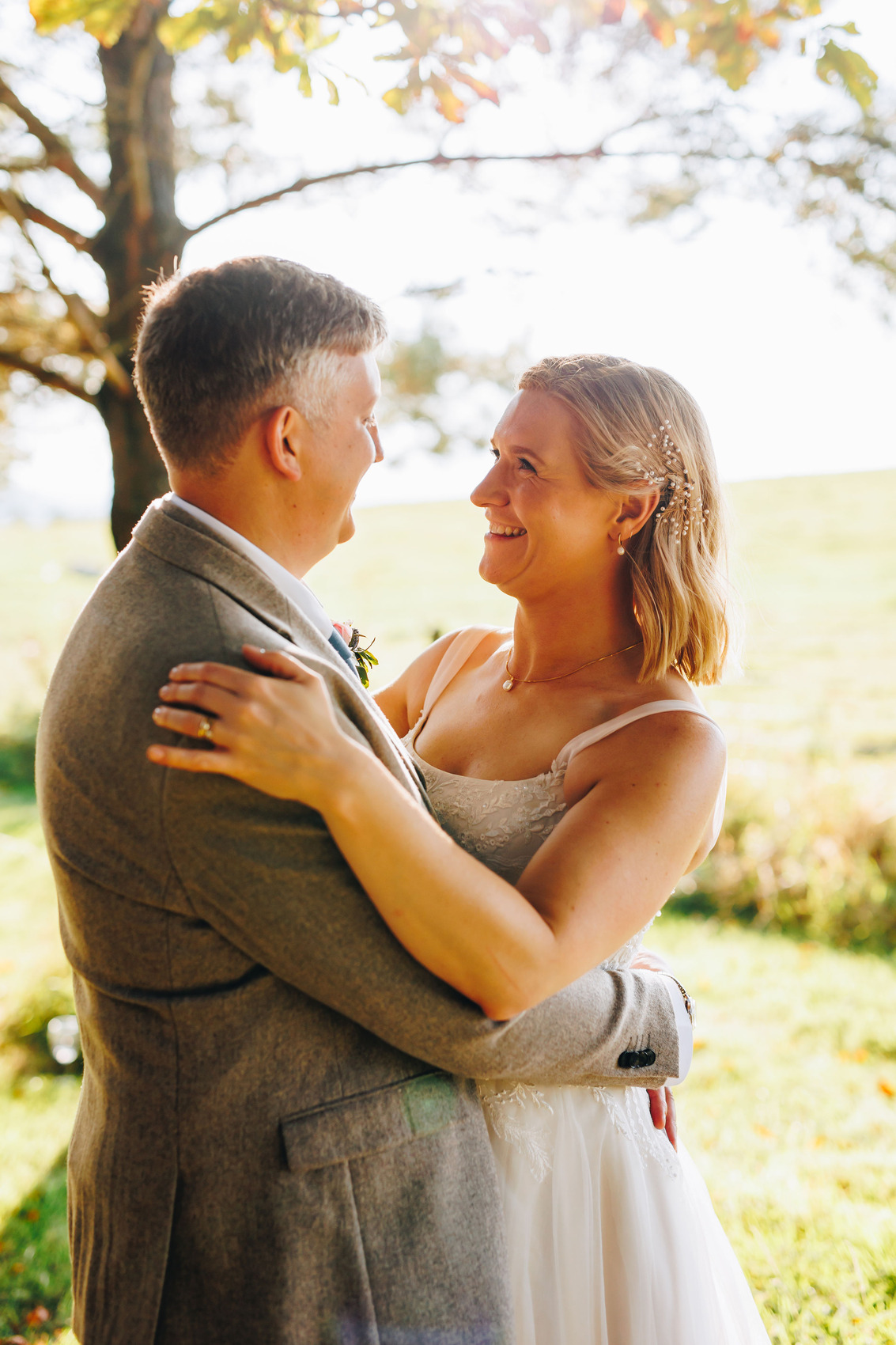 Smily couple at sunset amongst trees
