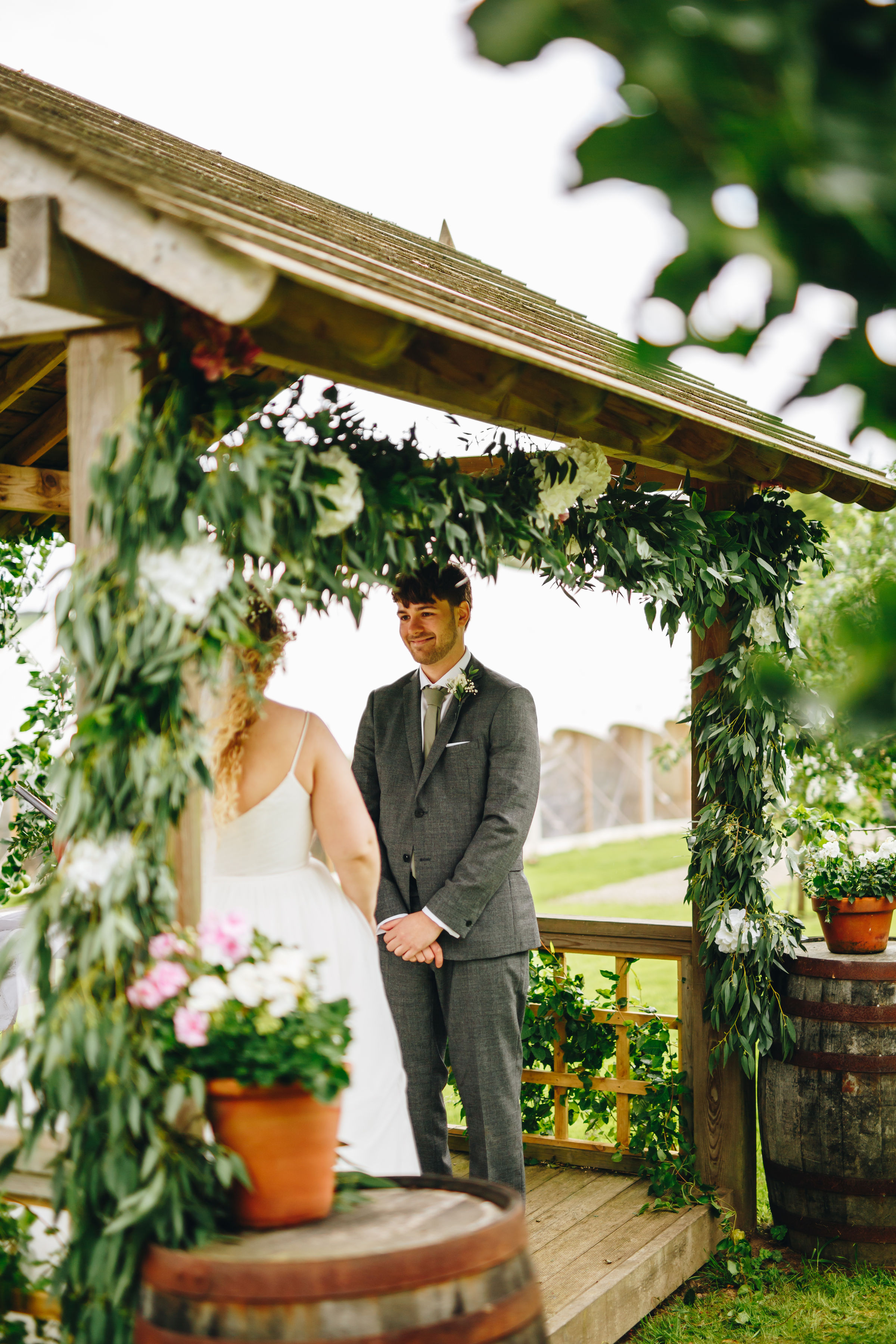 Bride and groom holding hands during their ceremony