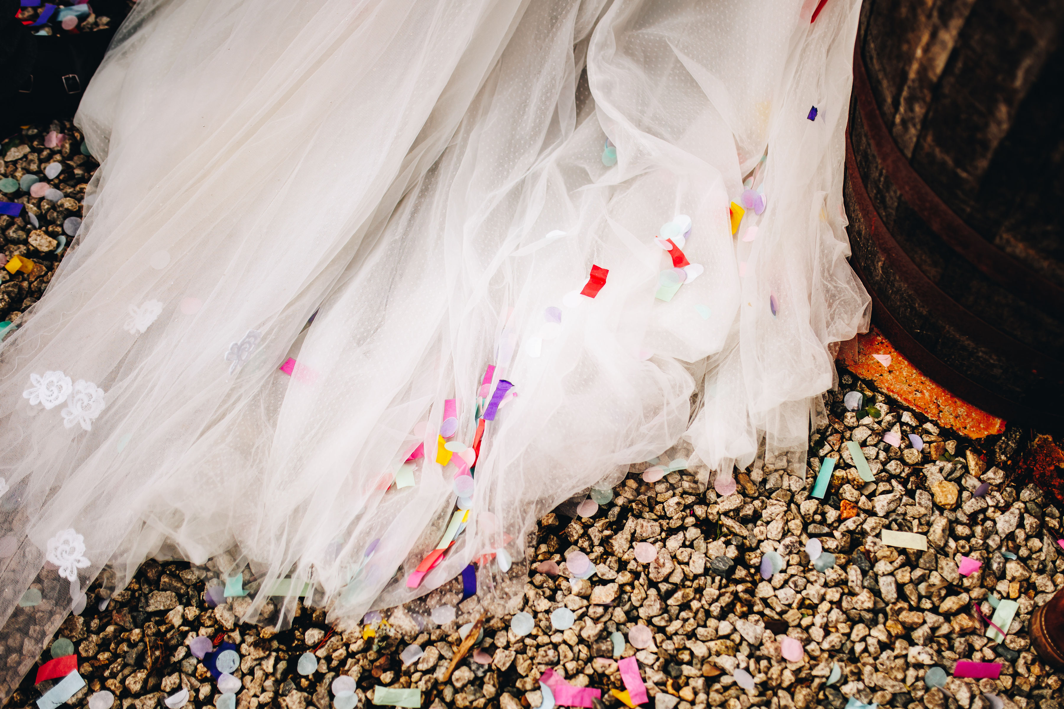 Confetti on bride's dress