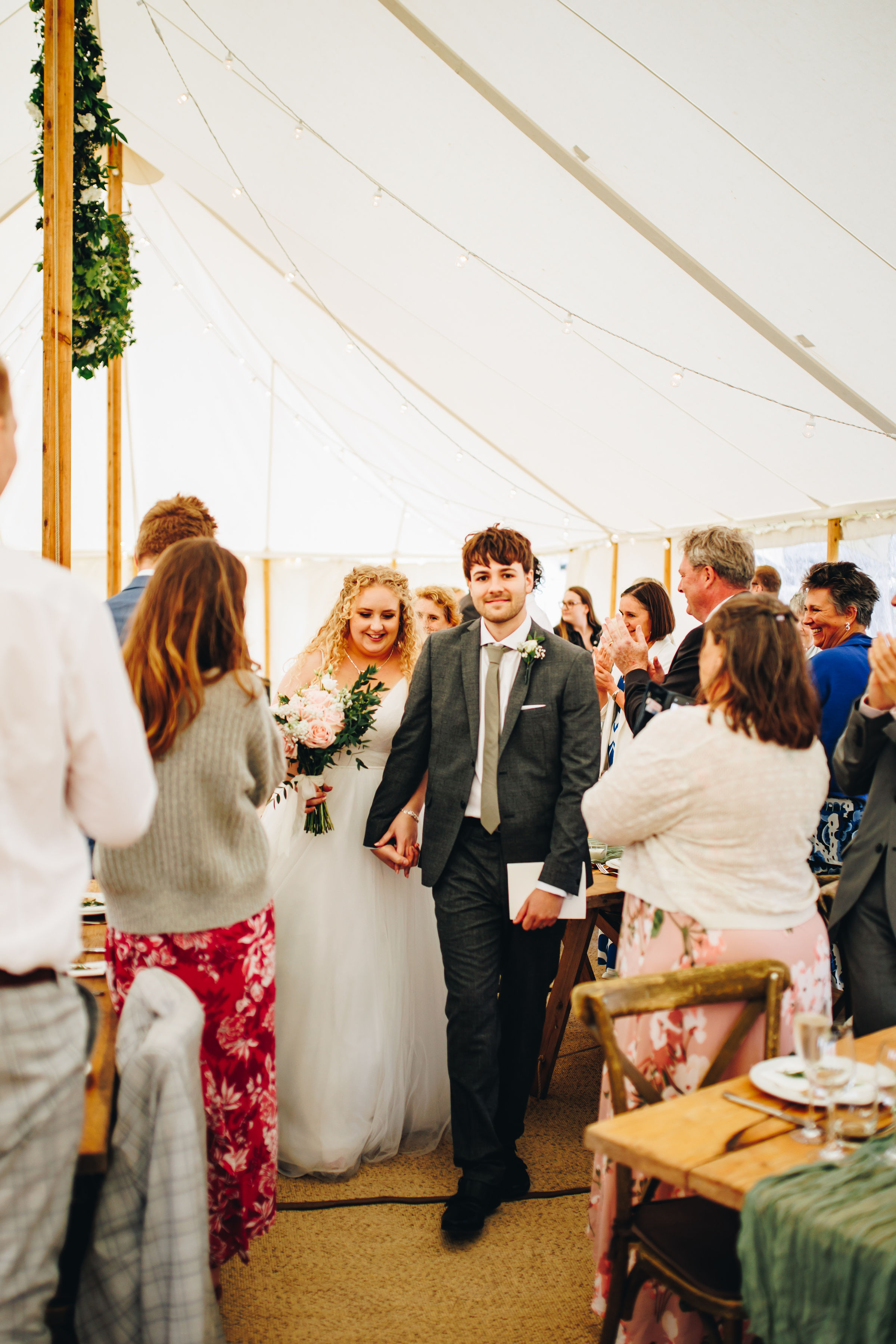Bride and groom heading to their table