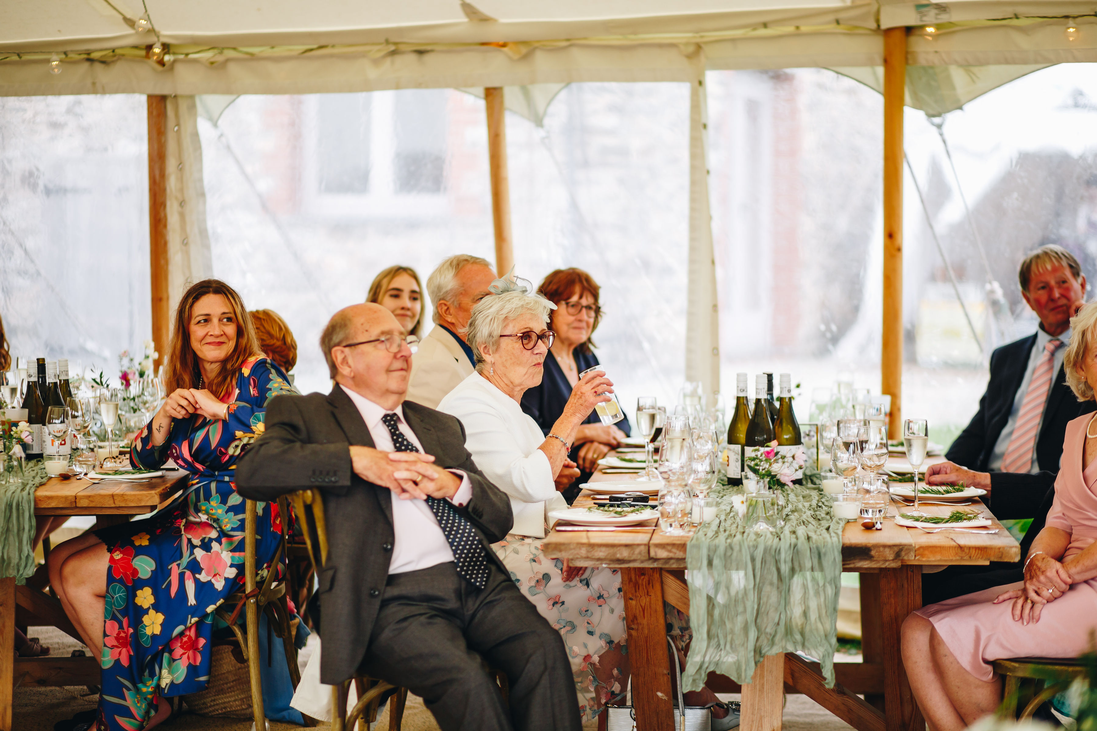 Guests smiling at speeches