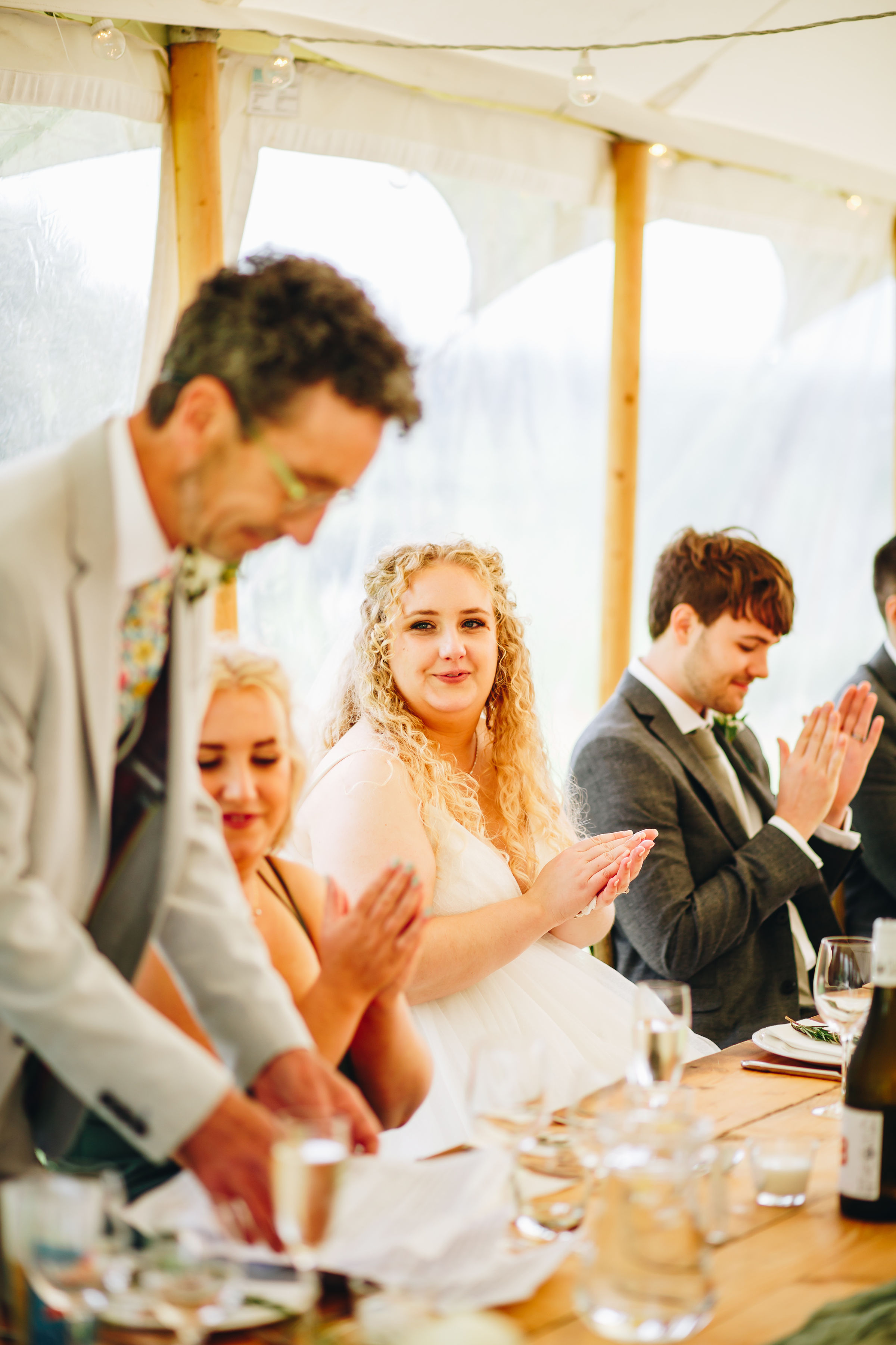Bride clapping at her dad's speech