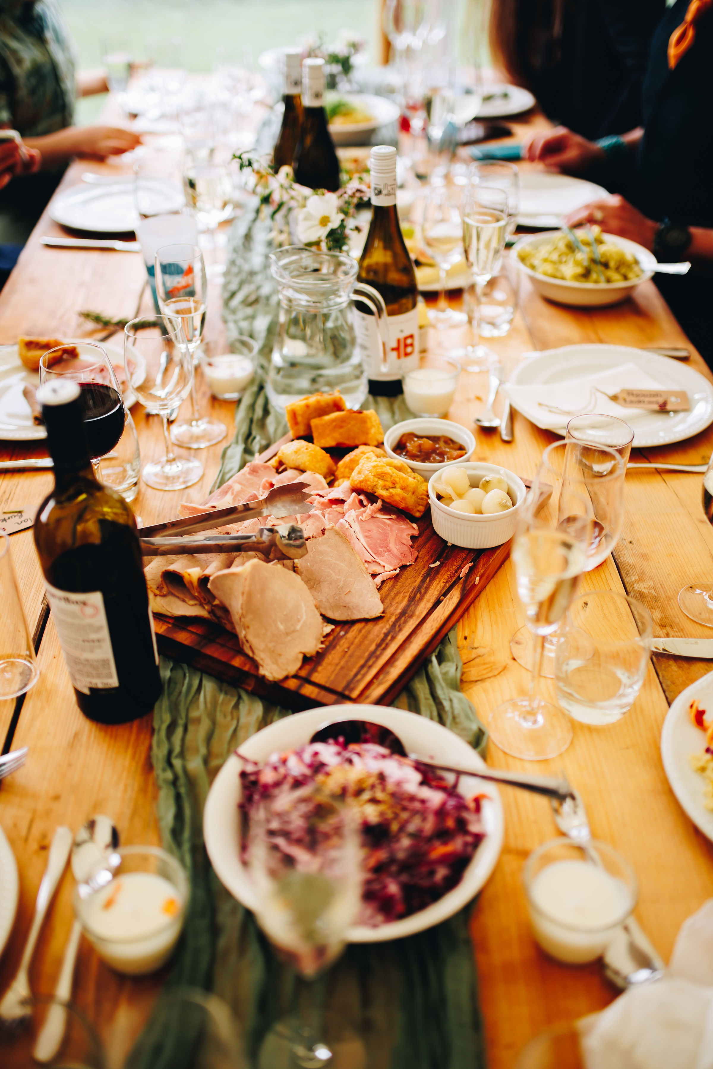 Sharing platters of food on a wooden table