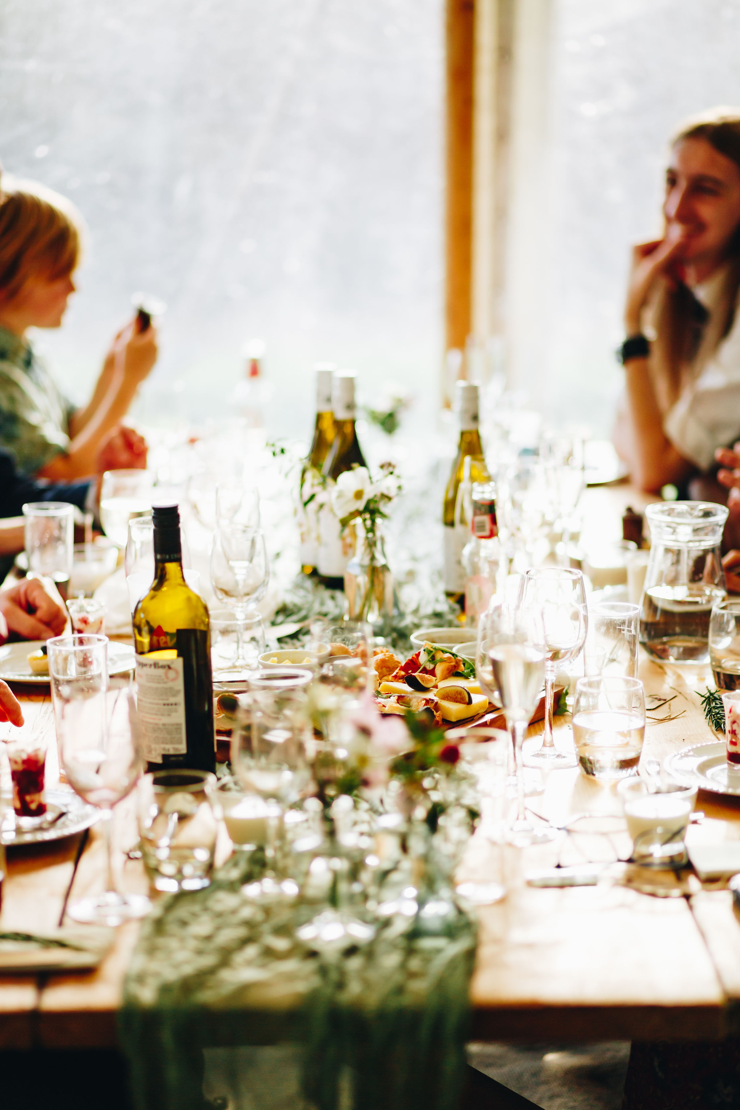 Sharing platters of food on a wooden table