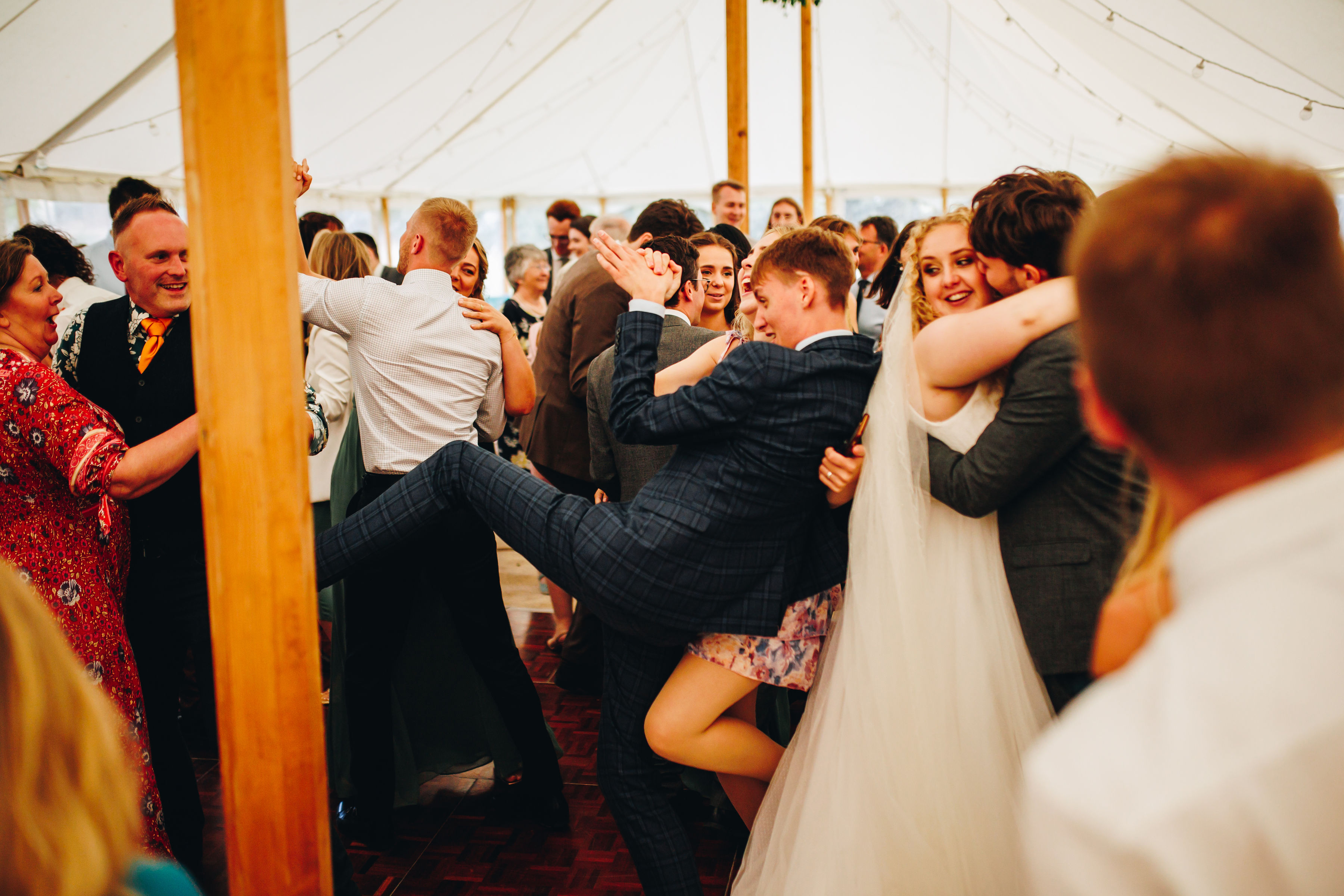 Wedding guests dancing madly