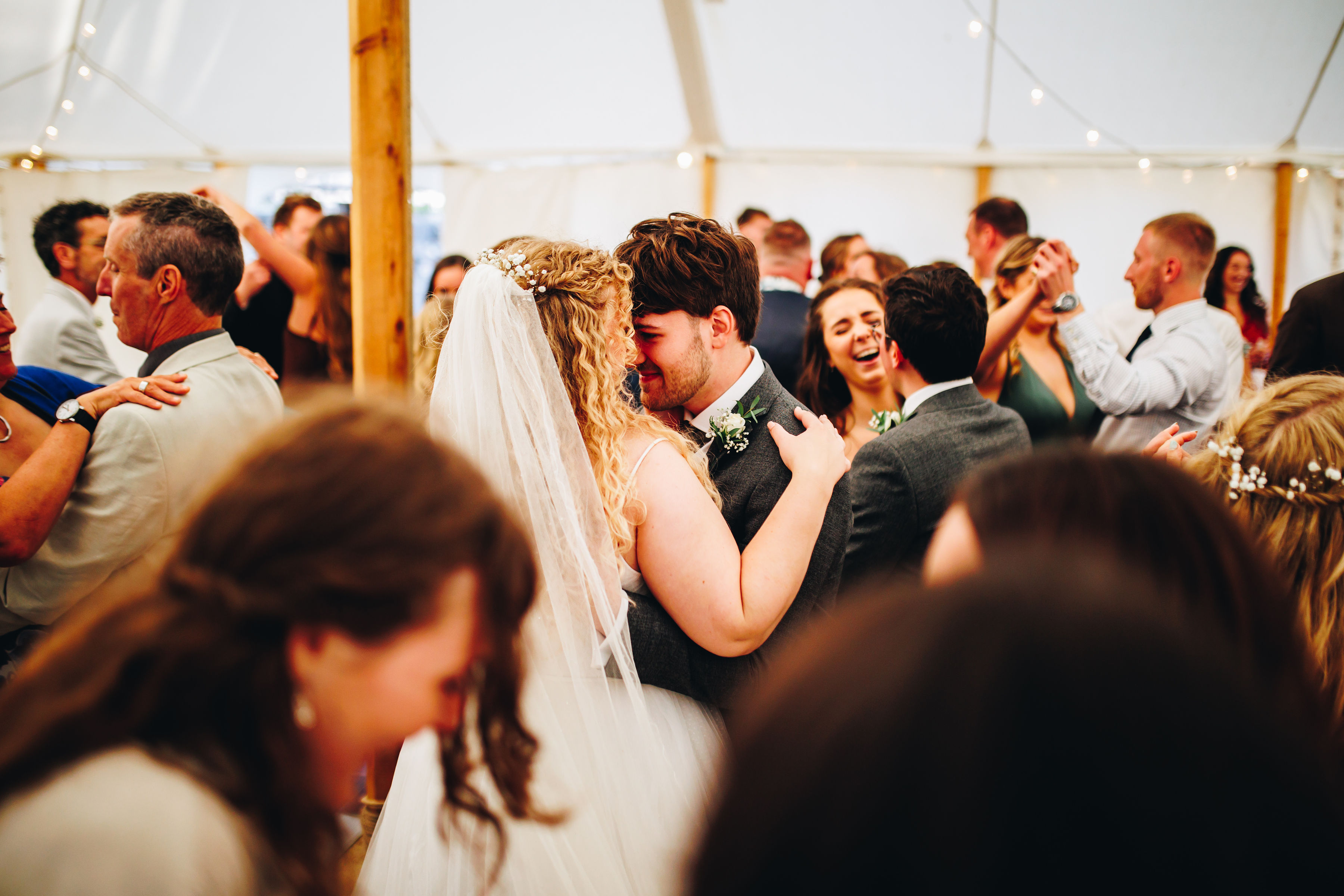 Bride and groom forehead to forehead on the dance floor