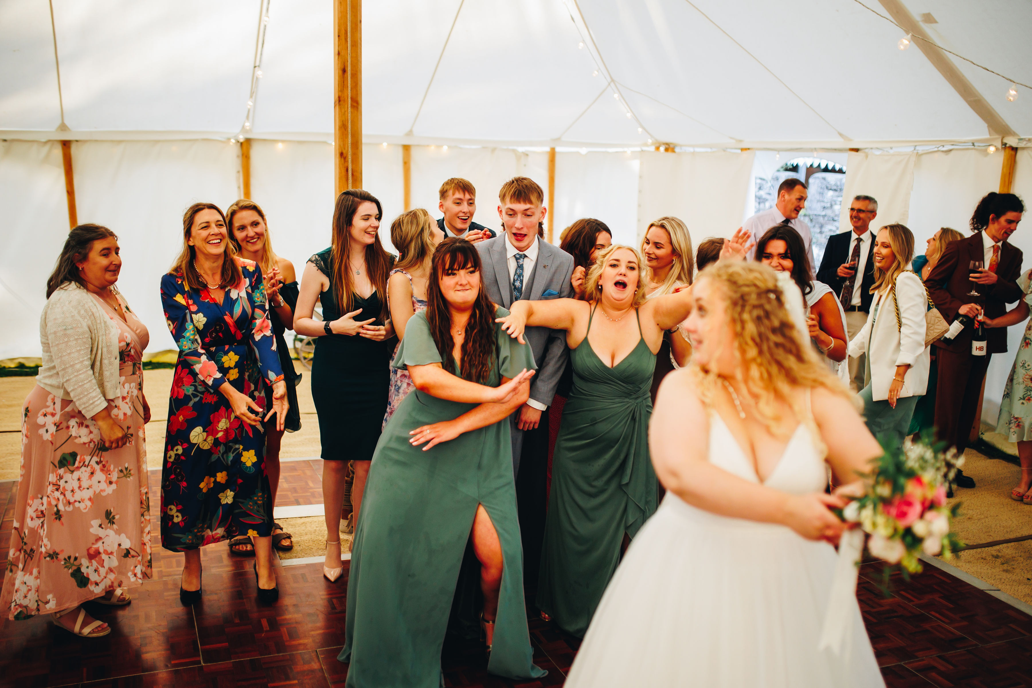 Bouquet toss - cousin caught it and celebrating