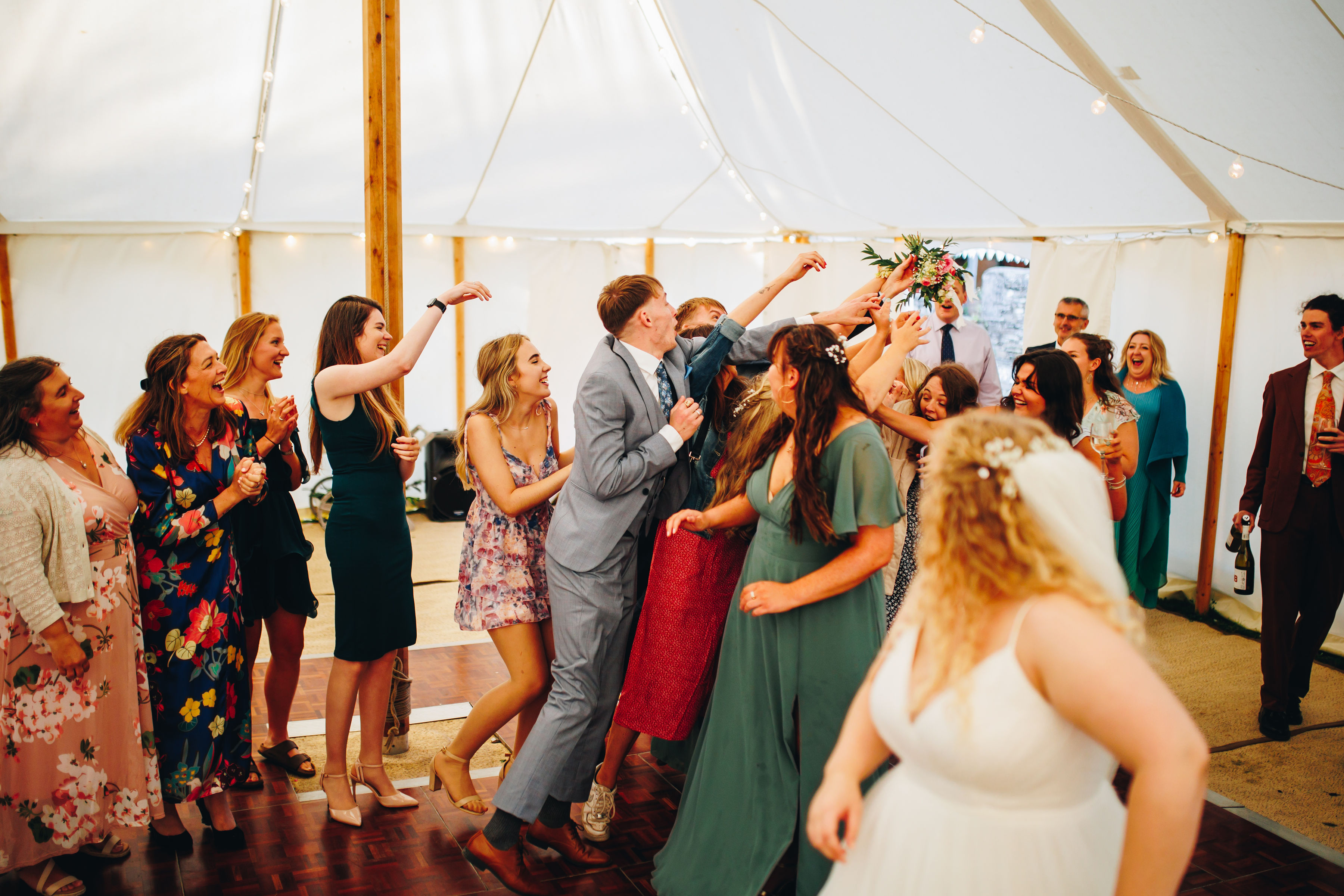 Bouquet toss - cousin caught it and celebrating