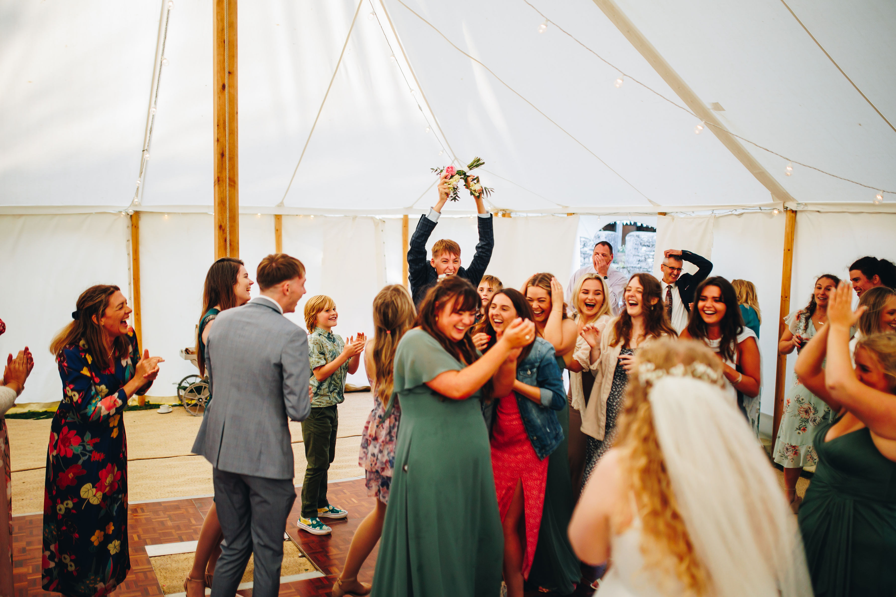 Bouquet toss - cousin caught it and celebrating