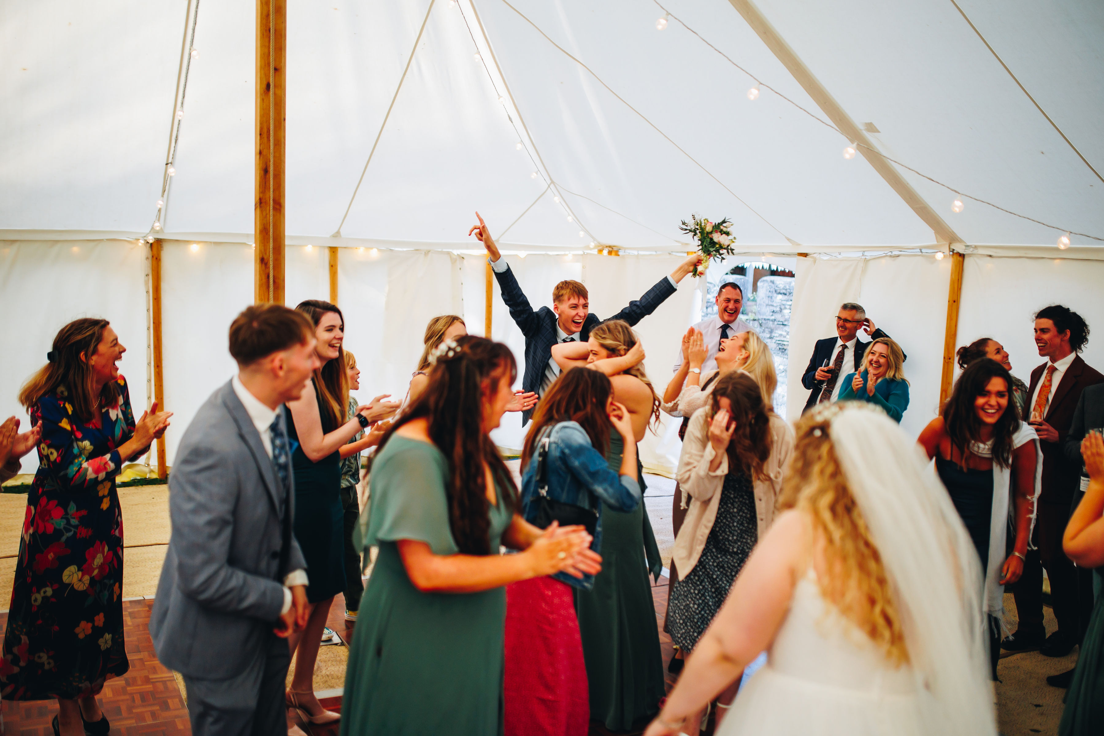Bouquet toss - cousin caught it and celebrating