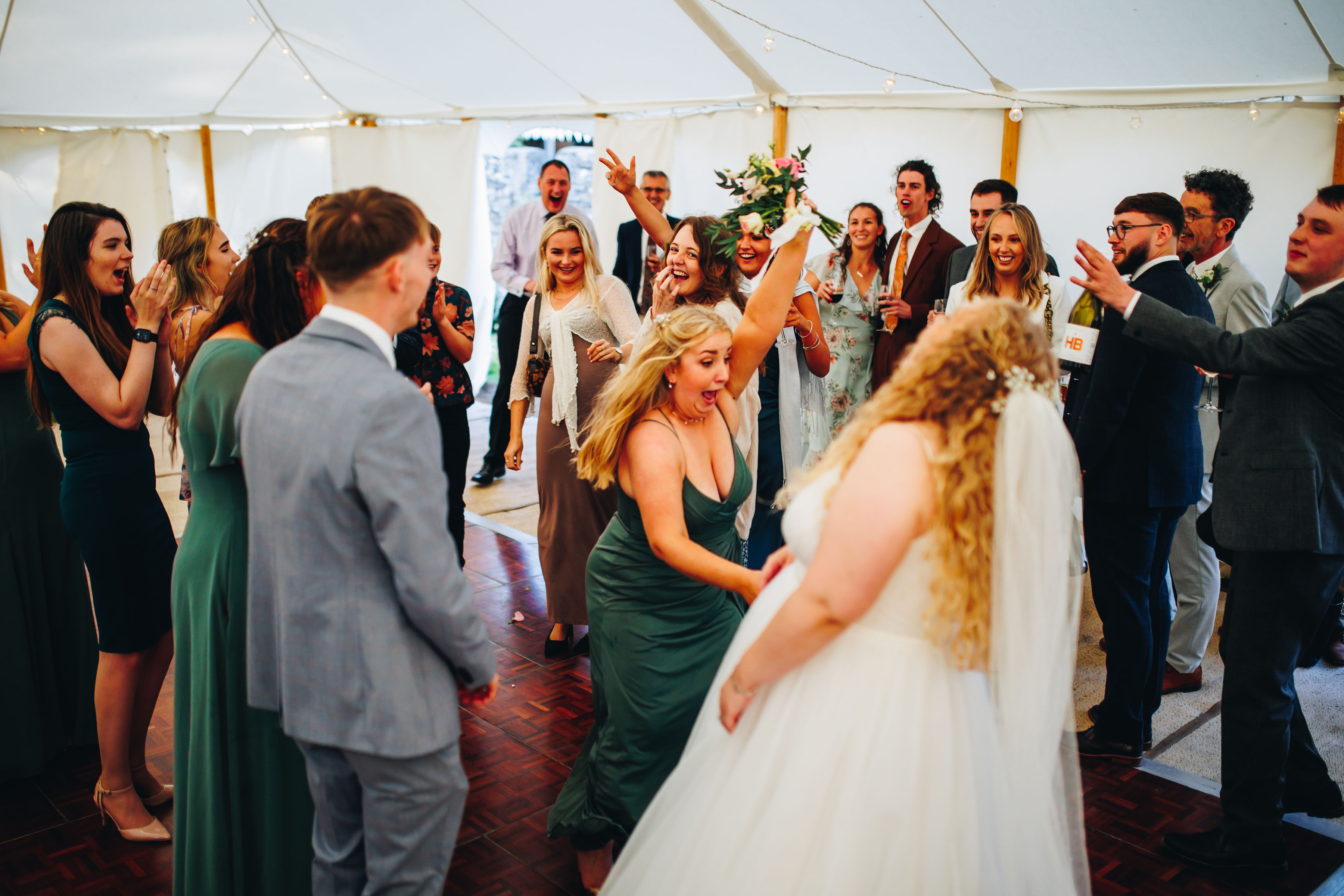 Bouquet toss - cousin caught it and sister then stole it