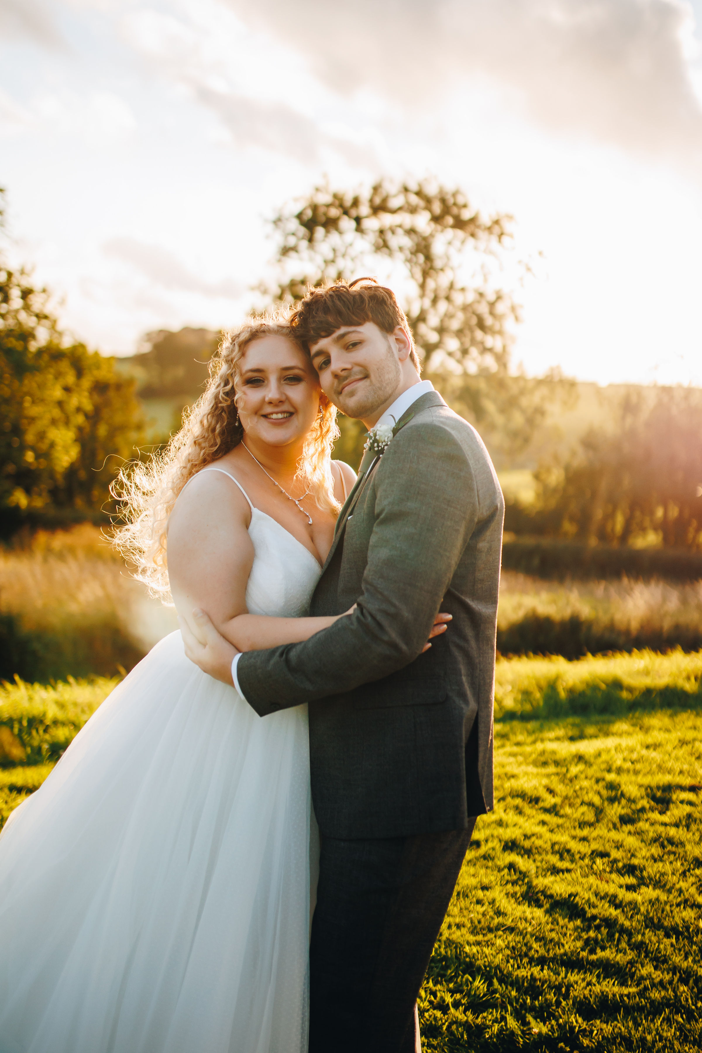 Couple dancing at sunset in a field