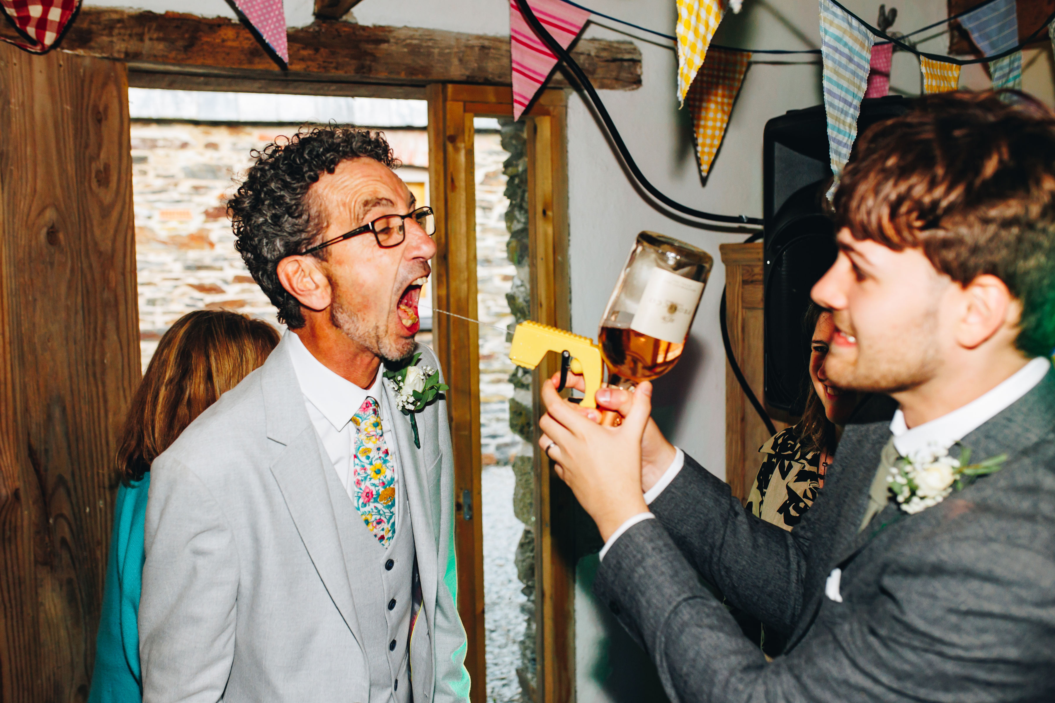 Groom using Prosecco gun