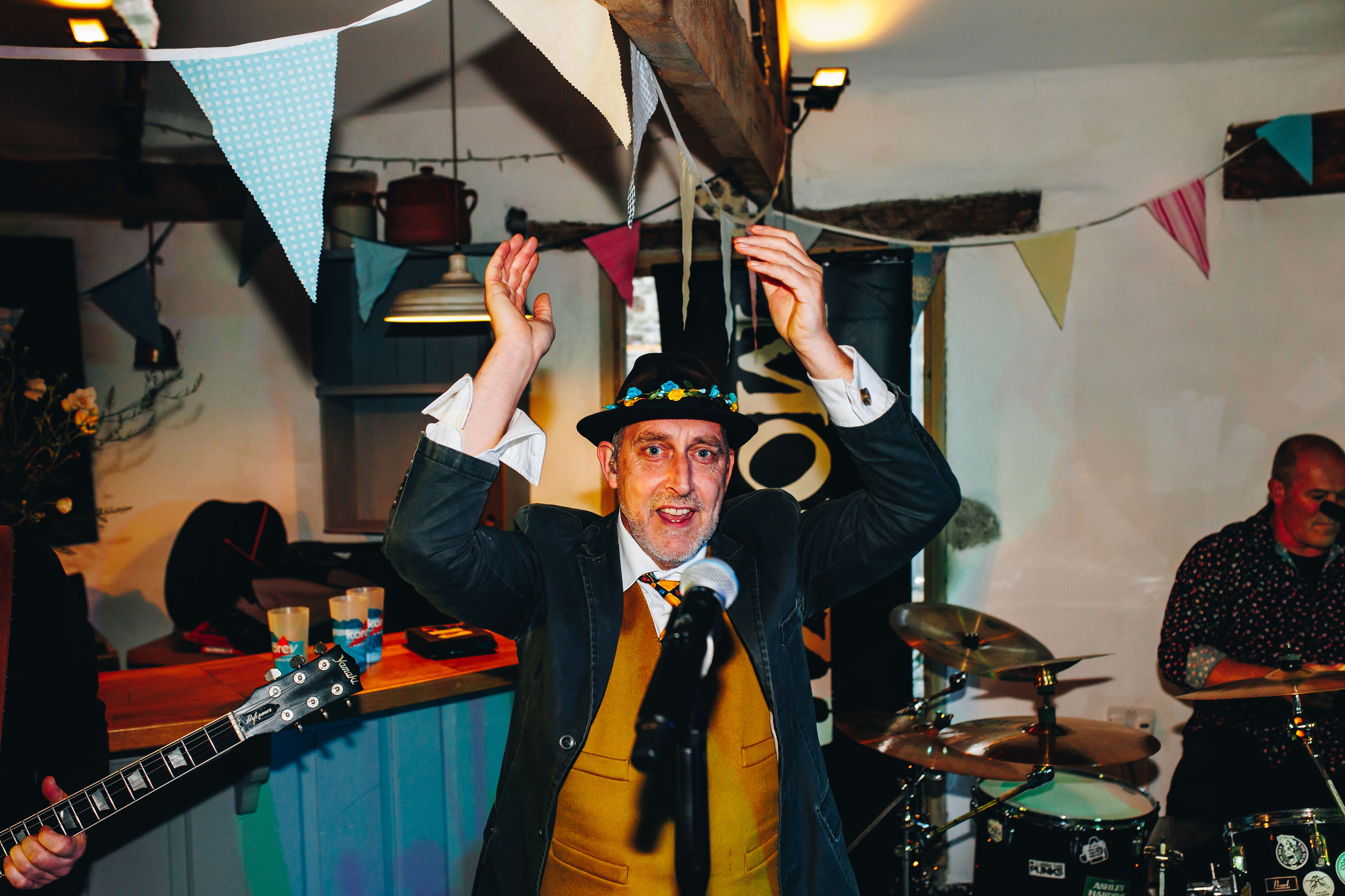 Lead singer of band clapping and singing