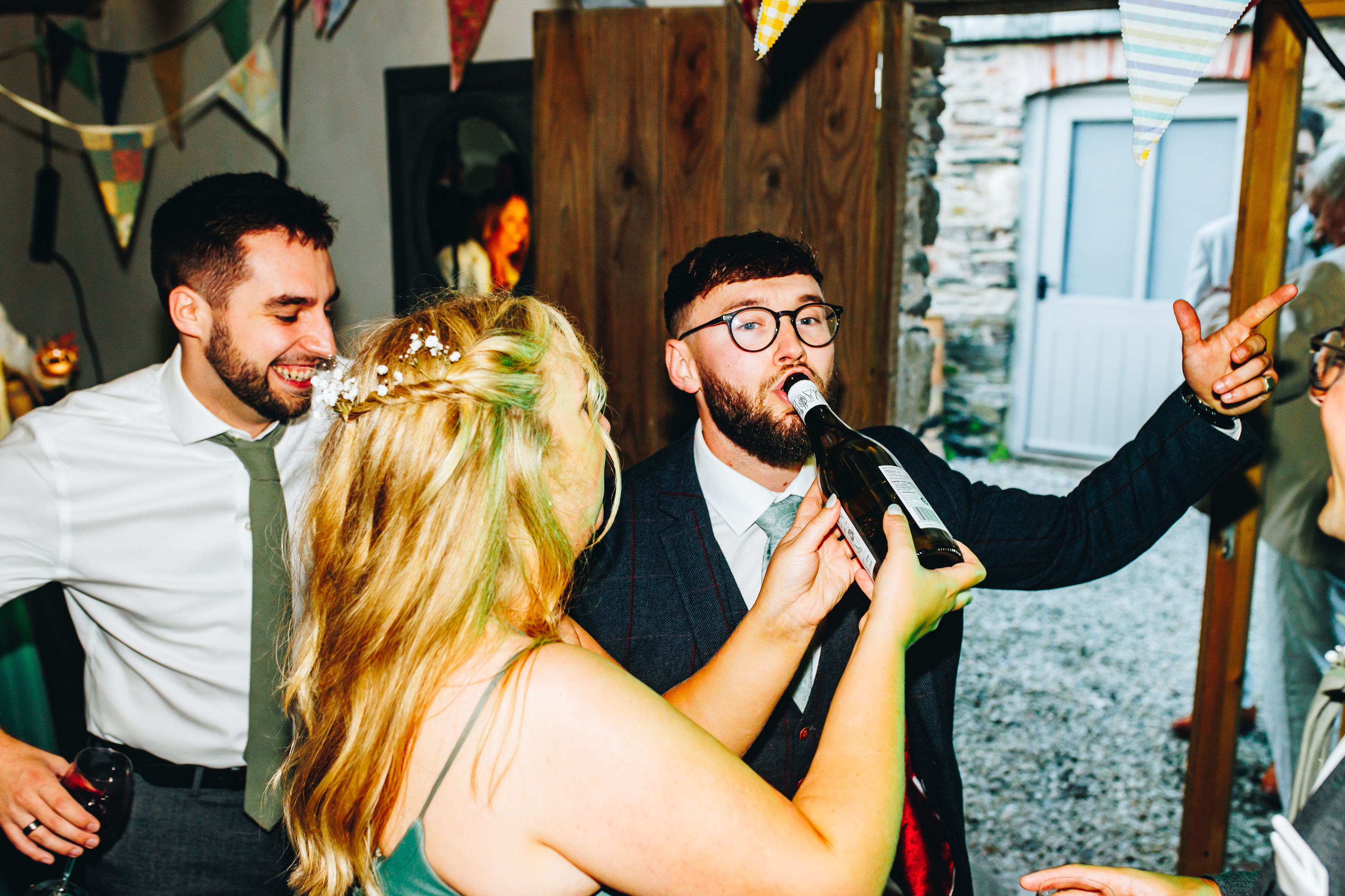 Guest drinking from the bottle on the dancefloor