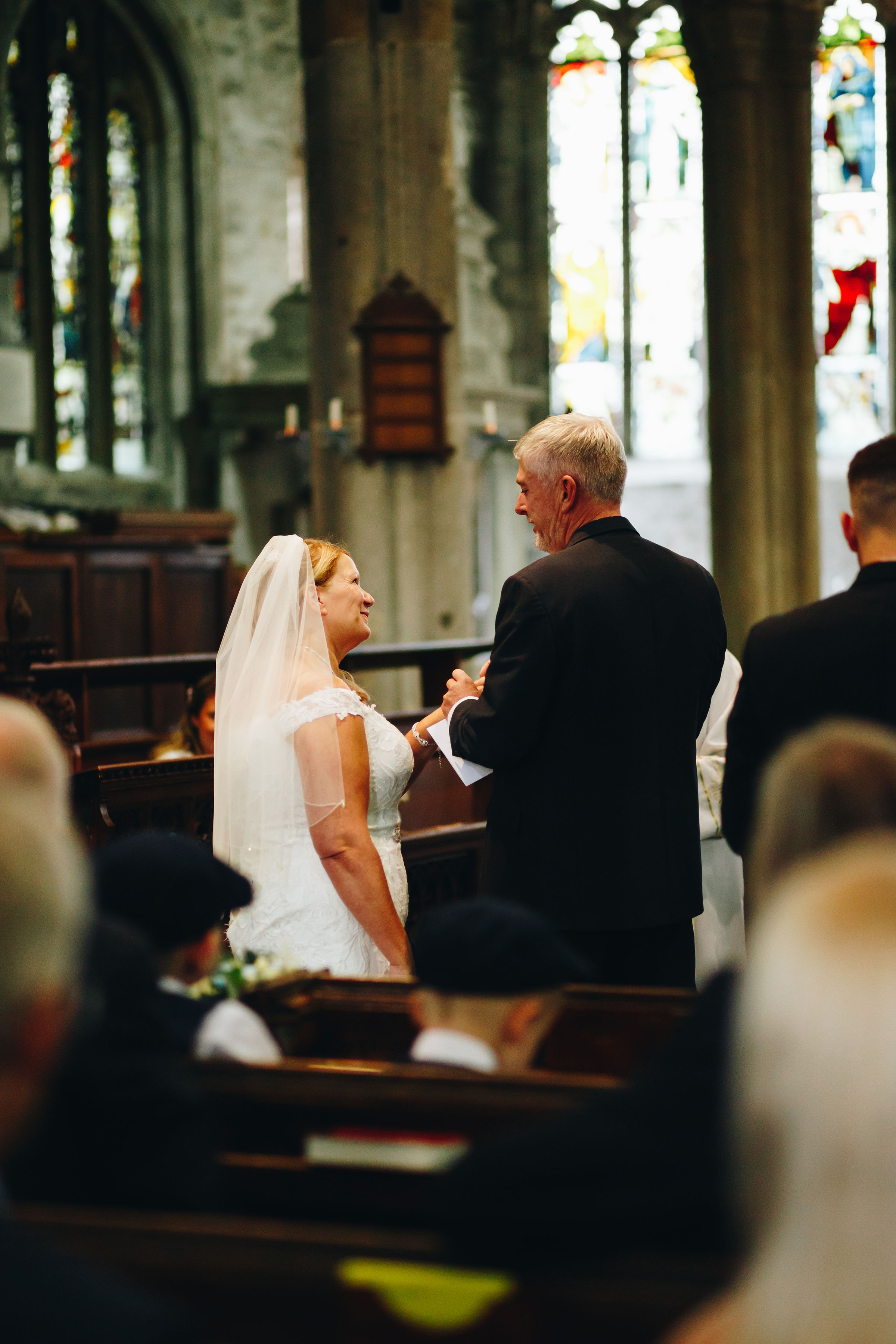 Bride and groom saying vows in church