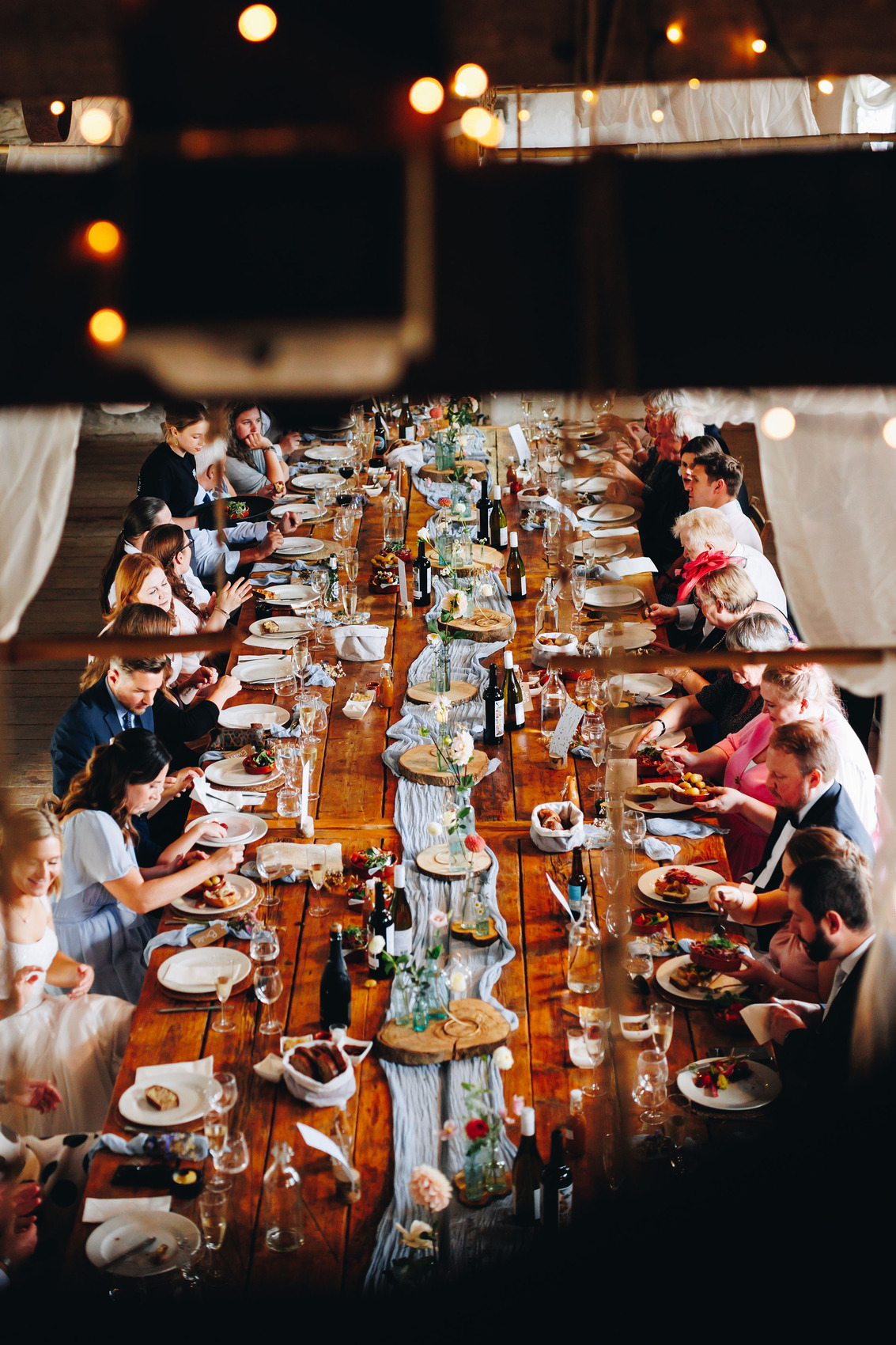 Tablescape at Bradstone Manor with food by Astridges Catering, photographed from above amongst the beams